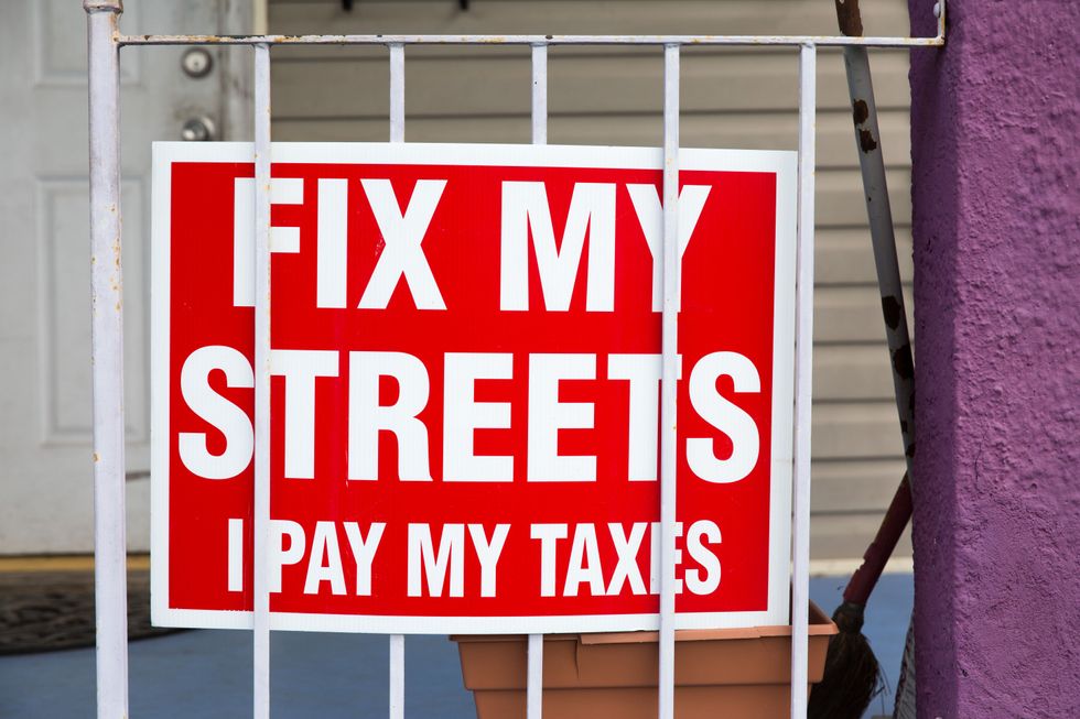 ​Sign reads ''FIX MY STREETS I PAY MY TAXES'' is seen outside the Lower Ninth Ward Living Museum in Lower Ninth Ward, New Orleans, Louisiana, United States.