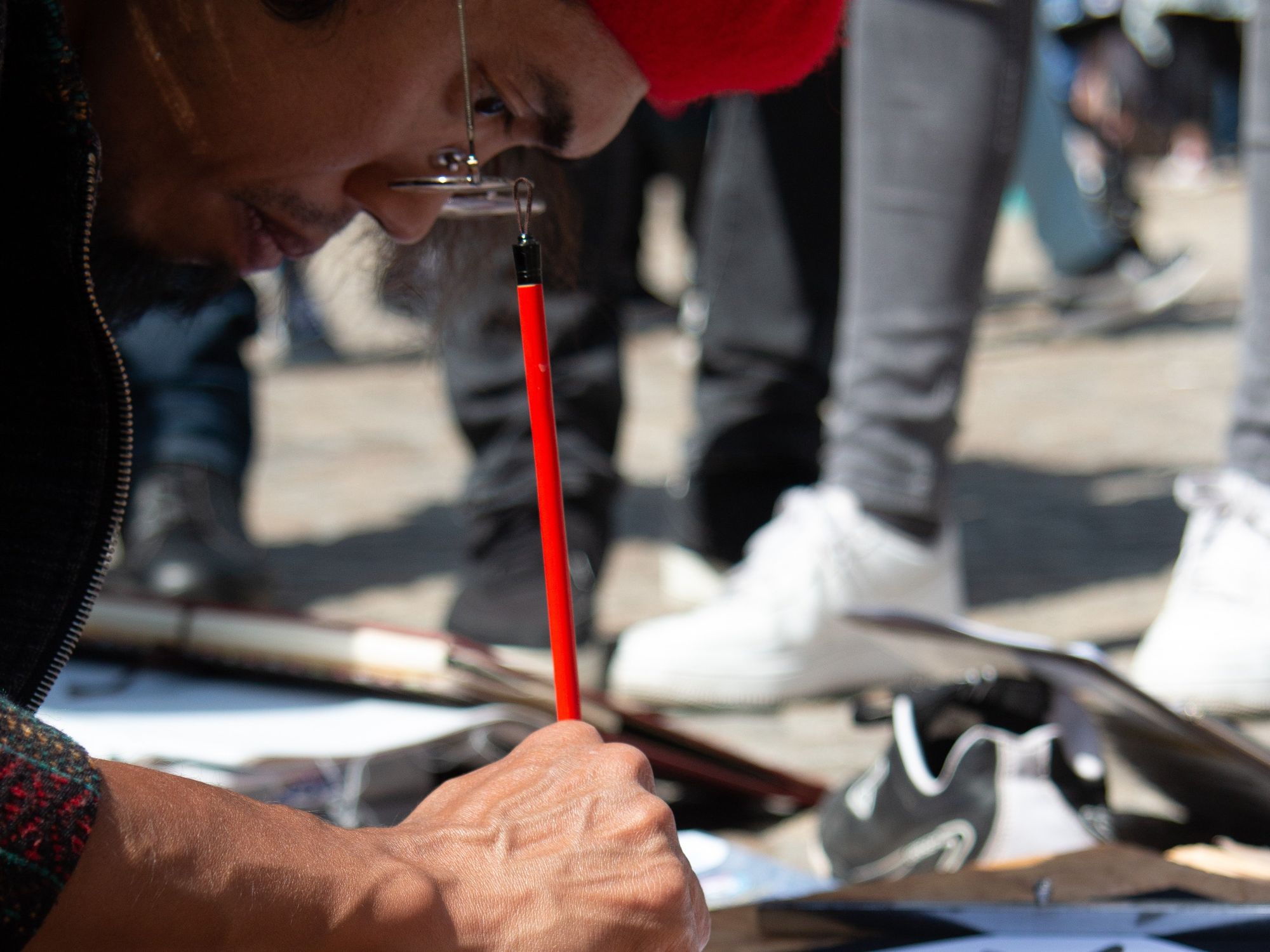 ​Street artist painting on paper