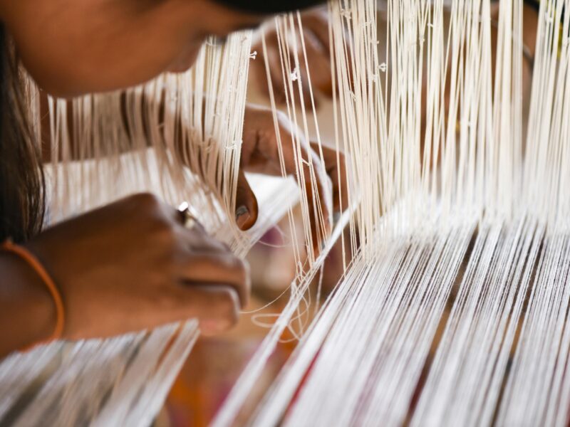 ​Student weaving silk and cotton costumes in a traditional handloom at a manufacturing unit in Guwahati, India, in November 2020.