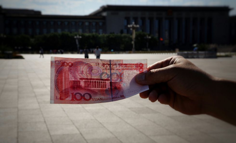 ​The 100 Yuan Chinese banknote, depicting a Portrait of Mao Zedong and the "Gate of Heavenly Peace", the gate to the forbidden city.