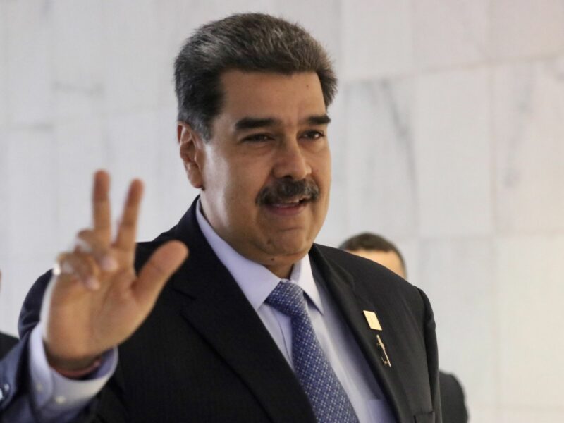 ​The President of Venezuela, Nicolas Maduro waving towards the camera.