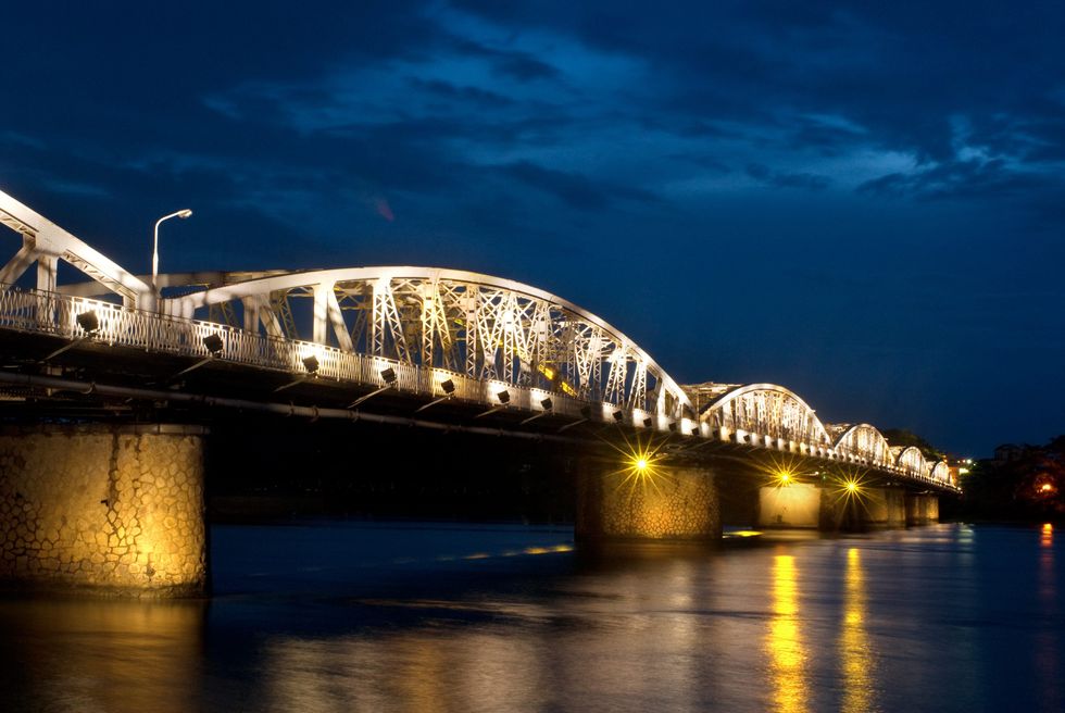 ​Trang Tien Bridge in Vietnam lit up at night.
