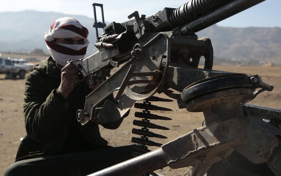 ​Tribal supporters of Yemen's Houthis hold up their weapons during armed a protest against the U.S. government designating Houthis as a terror group in Sanaa, Yemen.