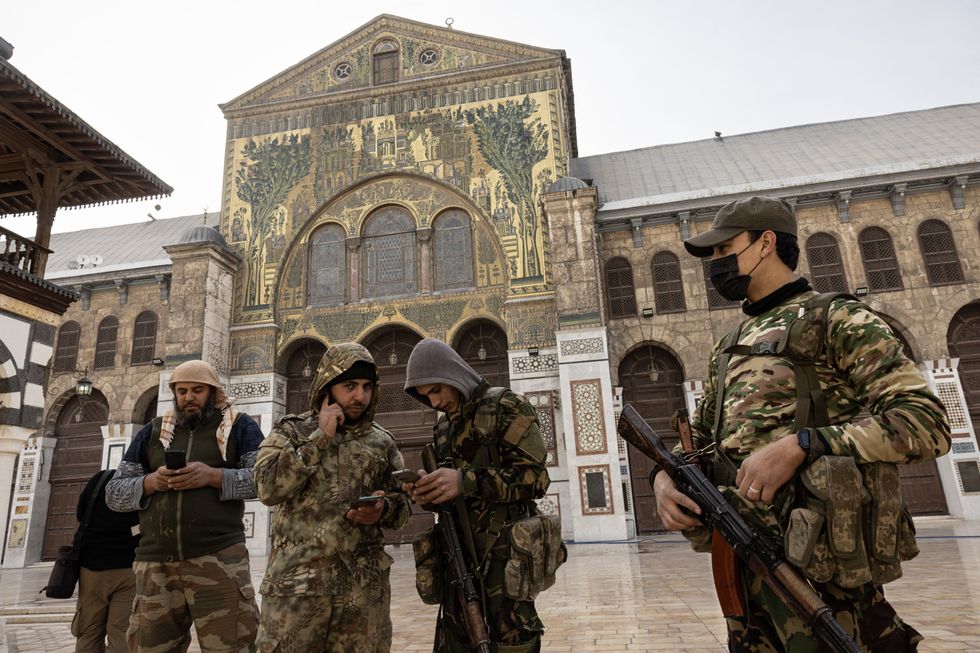​TS (Hayat Tahrir al-Sham) fighters took photos in Great Umayyad Mosque, one of the oldest and largest mosques in the world, in Damascus, Syria, Dec. 10, 2024.