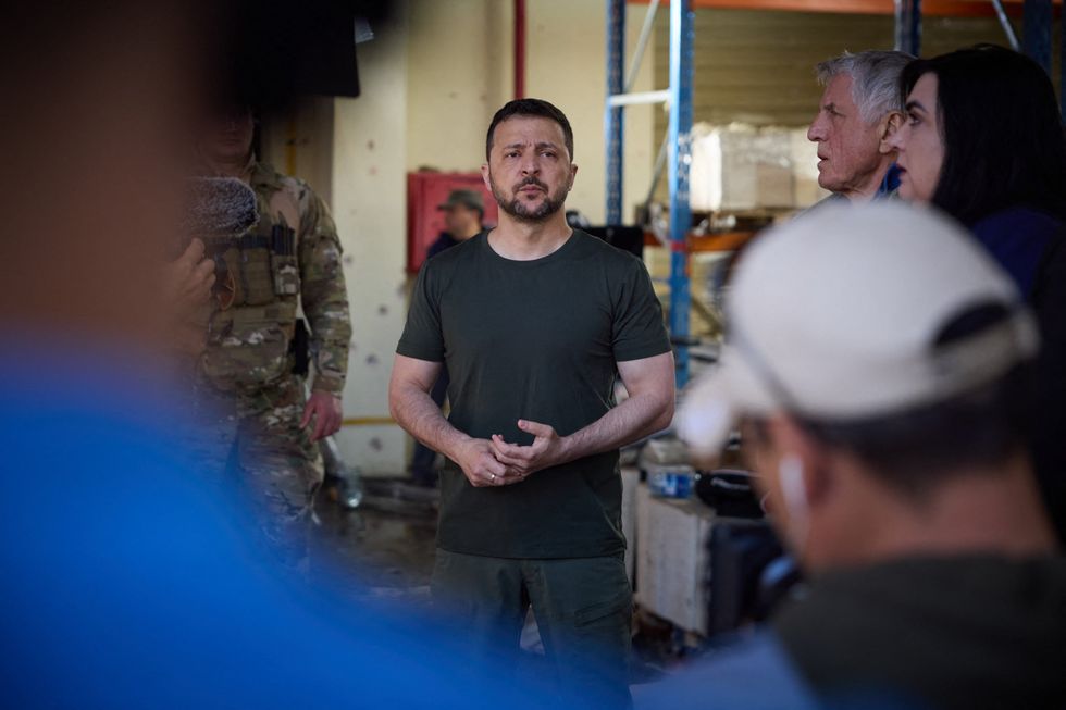 ​Ukraine's President Volodymyr Zelensky visiting the Kharkiv printing house destroyed by Russian missile shelling the day before Kharkiv, Friday and killed 7 people and injured 21.