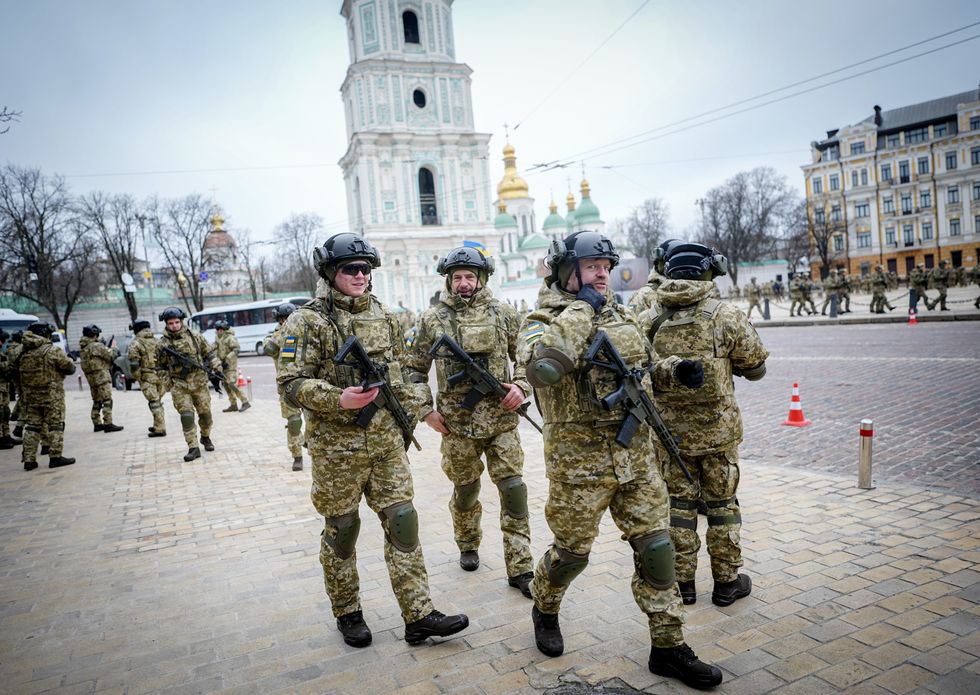 ​Ukrainian soldiers walking in Kyiv, on Feb. 24