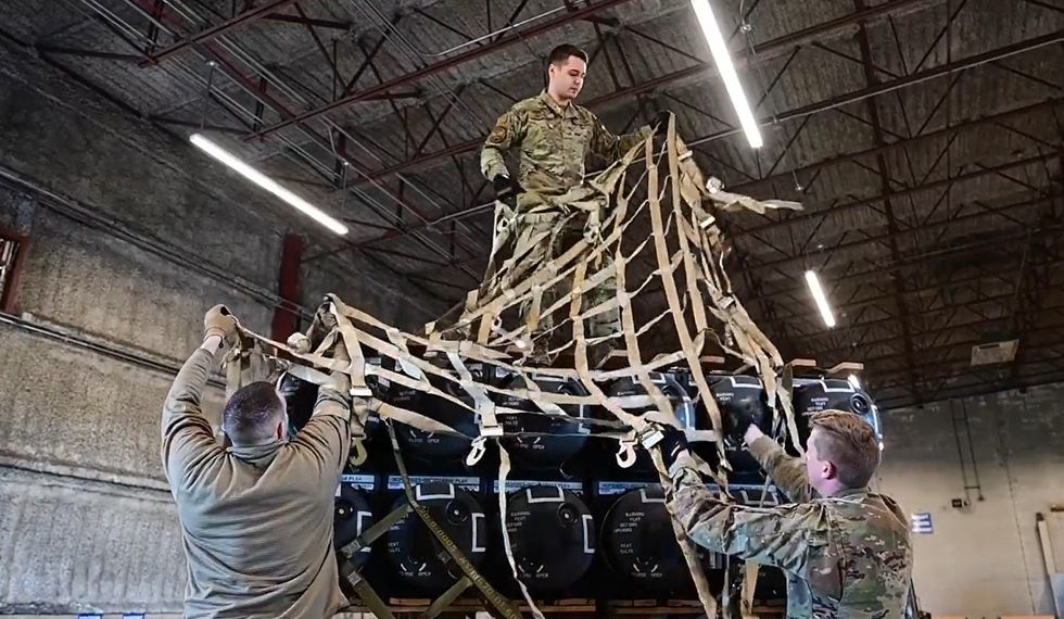 ​US Air Force personnel preparing to supply crates containing Stinger anti-aircraft systems, Javelin anti-armour systems, and other equipment bound for Ukraine at Dover Air Force Base in April 2022.