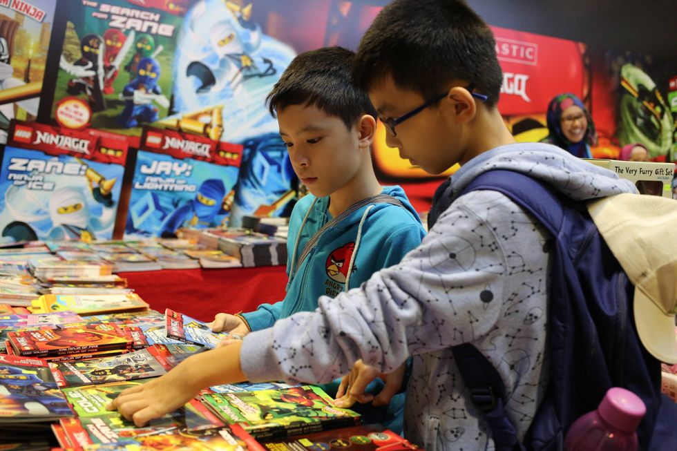 ​Visitors select books during the 2015 Singapore Book Fair in Singapore