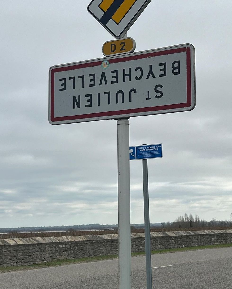 ​Welcoming town signs turned upside in an act of resistance from the countryside.