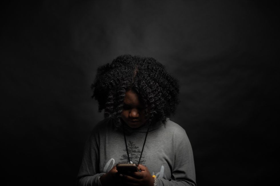 ​Woman holding a smartphone