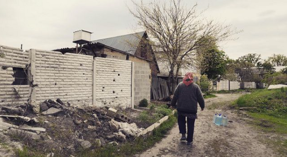 ​Woman walks in the north east of Kharkiv