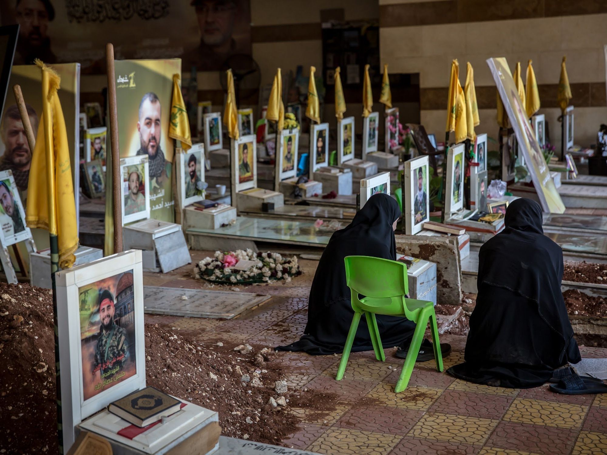 ​Women mourn at a grave at the Rawdat Alhawra' Zaynab cemetery for Shia Muslims in Beirut's southern suburbs in Beirut, Lebanon, Oct. 27, 2024.