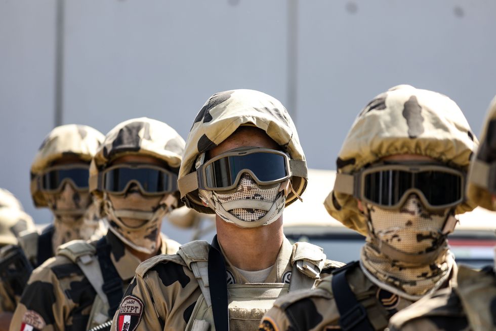 Egyptian Army Soldiers stand guard at the Rafah border crossing between Egypt and the Gaza Strip.