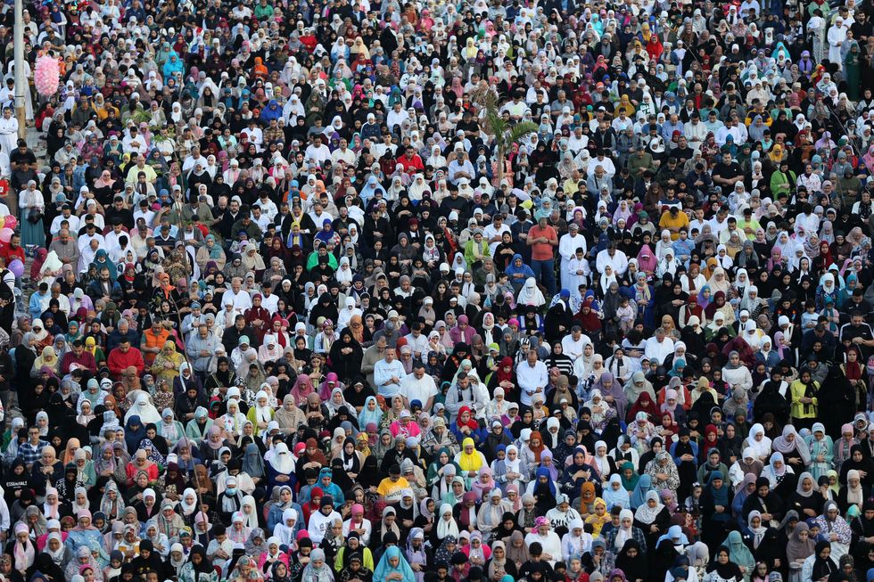 Egyptians attend Eid al-Fitr prayer which mark the end of the Holy month of Ramadan
