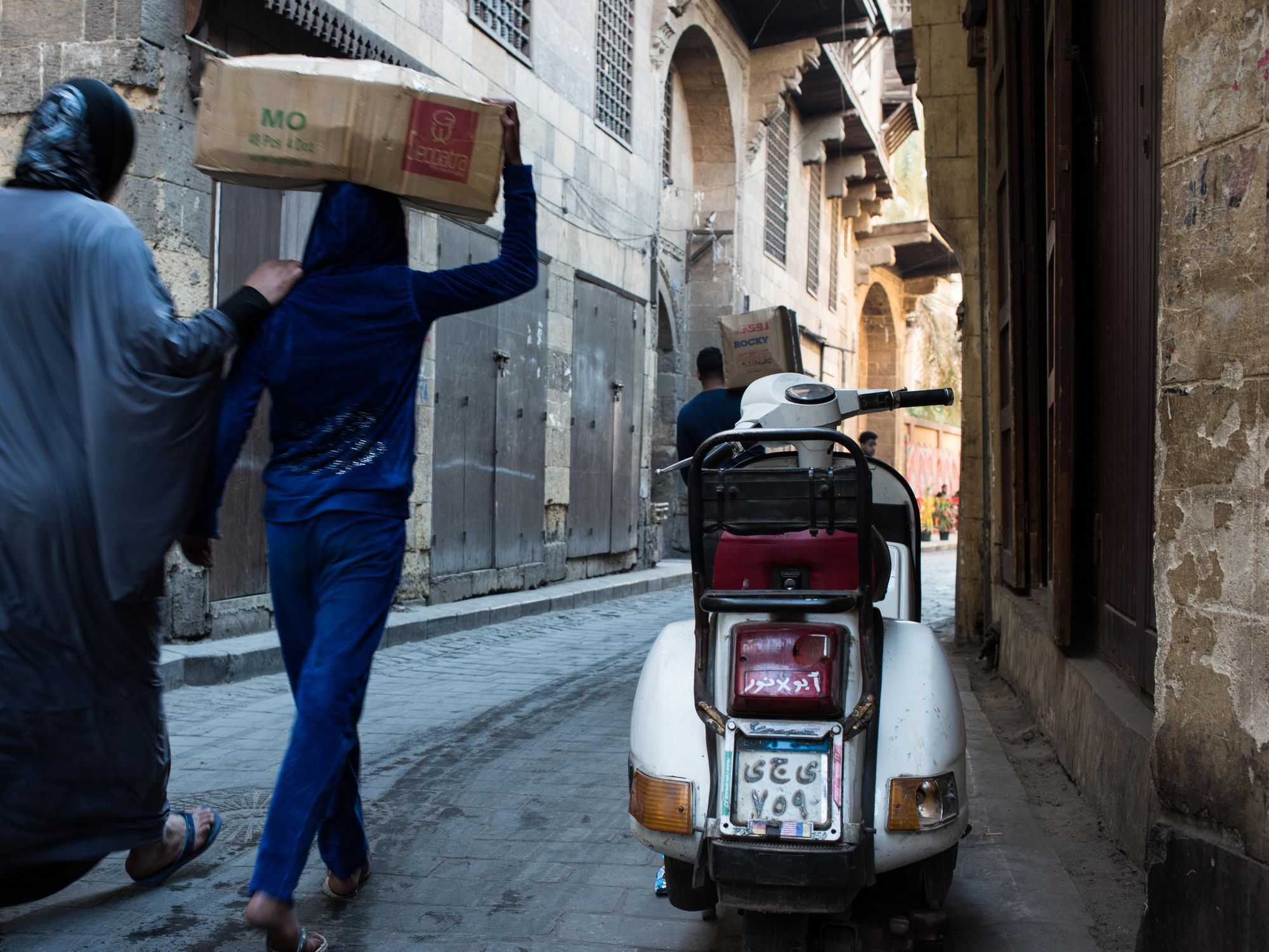 Egyptians walk in the Muizz Street in Cairo, Egypt, March 2, 2019.