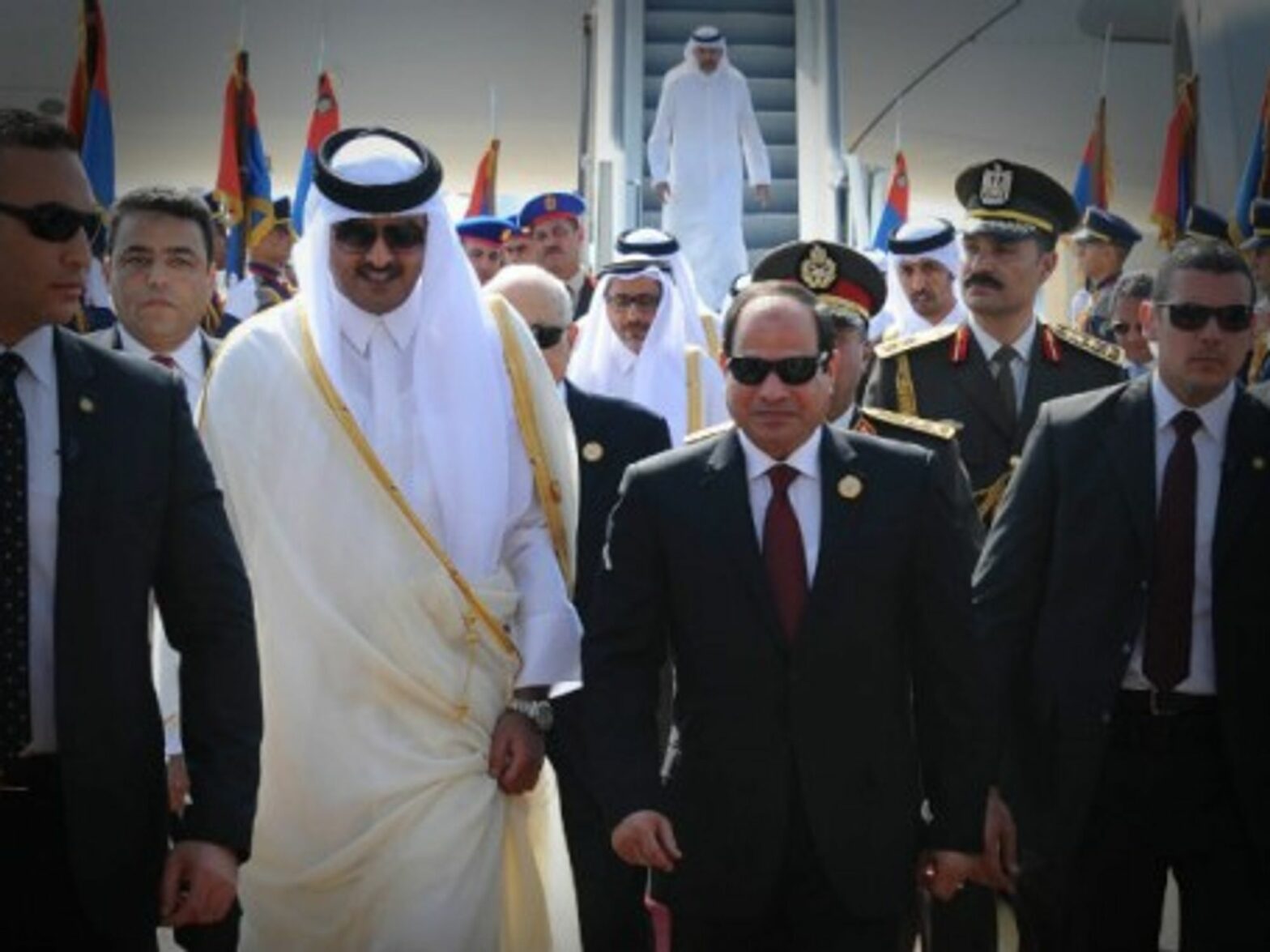 Egypti's al Sisi (R) receives Qatar Sheikh al Thani upon his arrival ahead of the Arab League Summit in Sharm el-Sheikh.