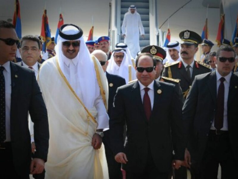 Egypti's al Sisi (R) receives Qatar Sheikh al Thani upon his arrival ahead of the Arab League Summit in Sharm el-Sheikh.