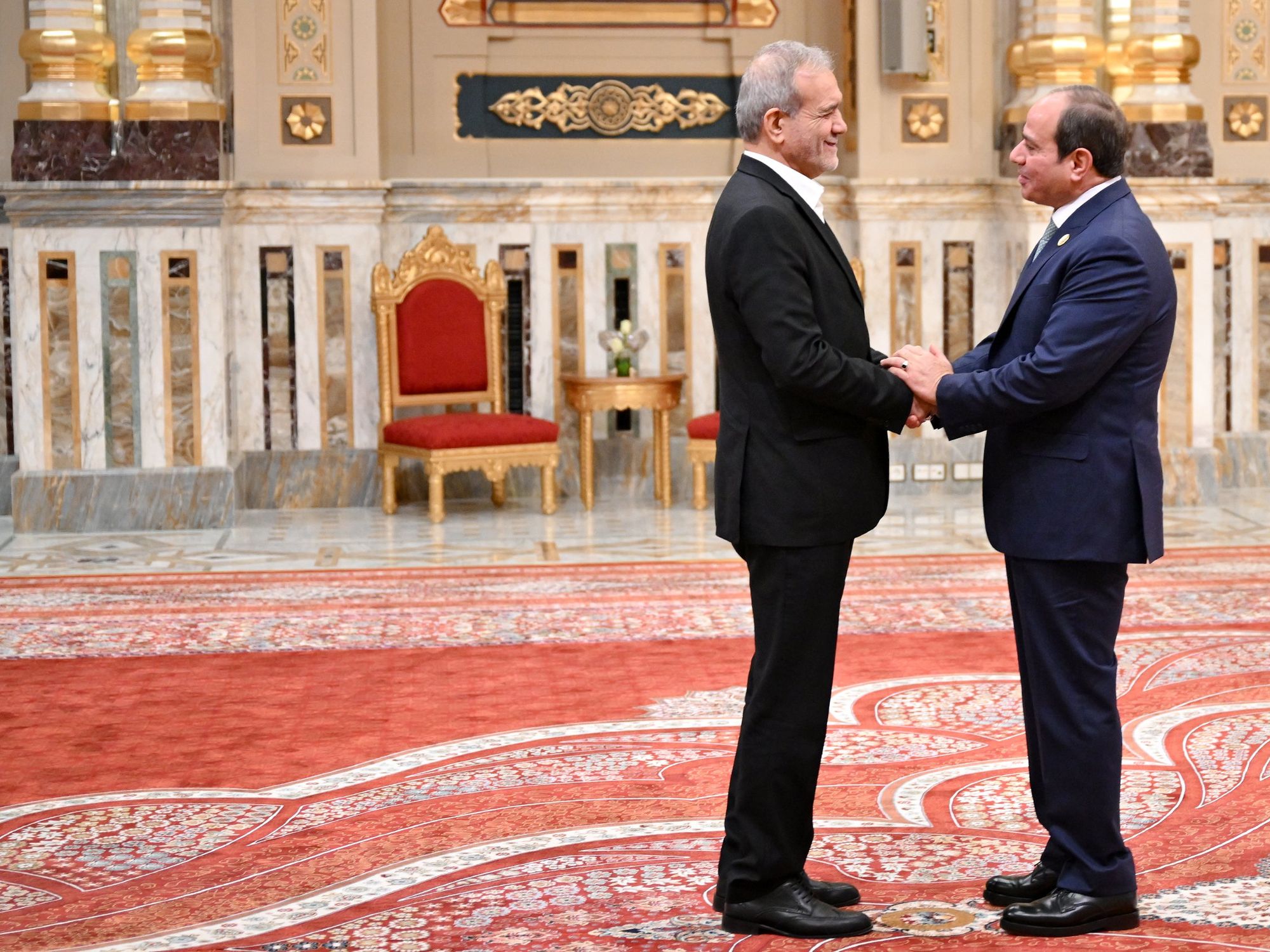 Egypt's President Abdel Fattah El-Sisi welcomes Iran's President Masoud Pezeshkian during the D-8 summit in Cairo​, Egypt on December 19, 2024