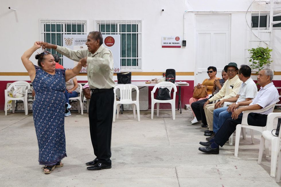 Elvira Moreno Abarca and her partner, Roberto Esteban Mateo Martínez, try not to miss the danzón classes at the Guerrero Institute for the Comprehensive Care of Older Adults.