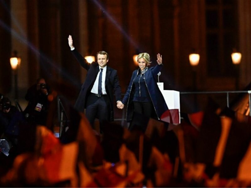 Emmanuel and Brigitte Macron celebrating with supporters on May 7