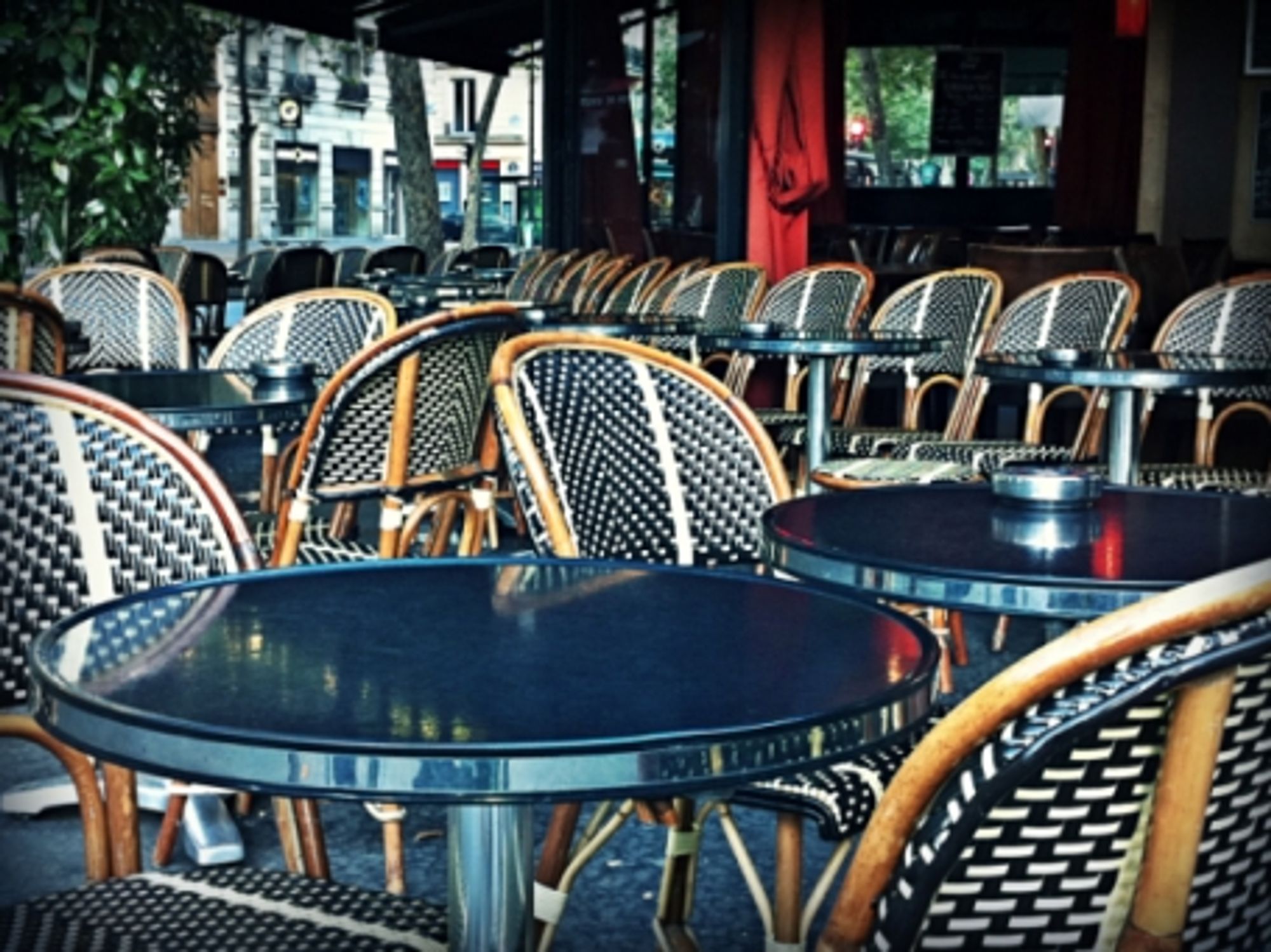 Empty seats on a Parisian cafe terrace
