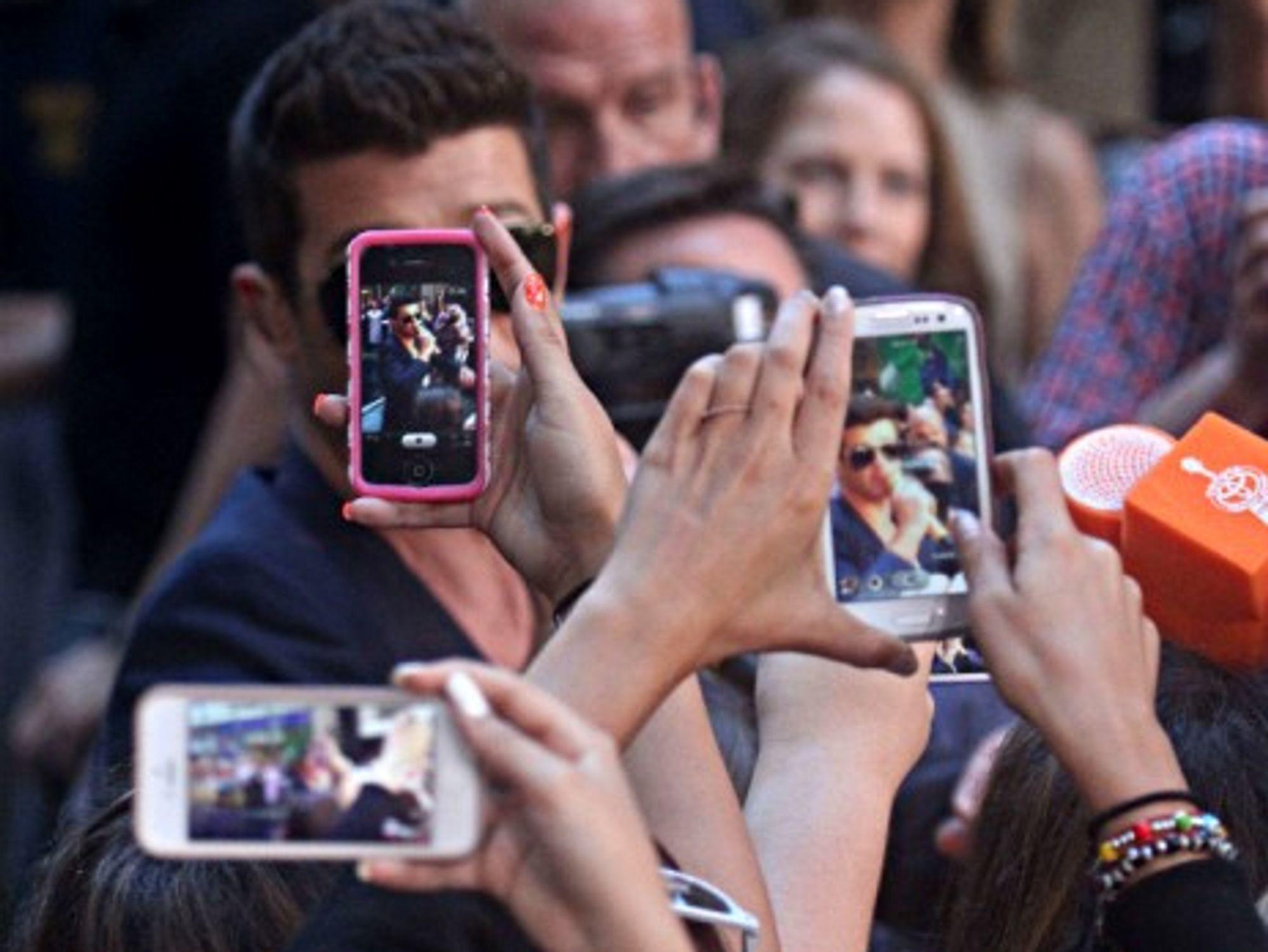"Enjoying" a performance by singer Robin Thicke