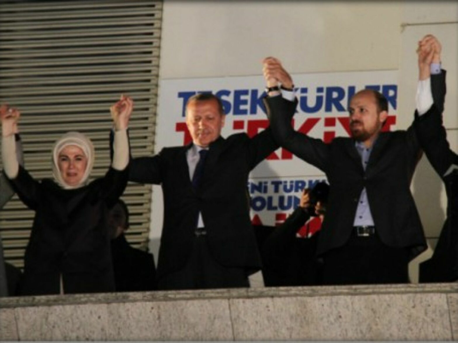 Erdogan (second from left) celebrates victory with his ruling party in the local elections