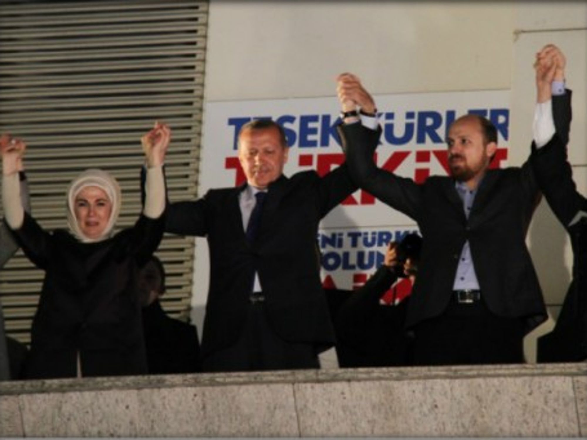Erdogan (second from left) celebrates victory with his ruling party in the local elections