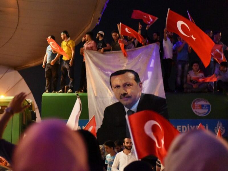 Erdogan's supporters carry his image