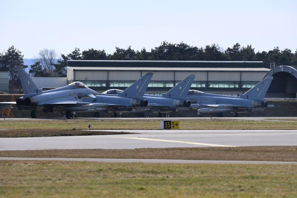 Eurofighters stand at the air base.
