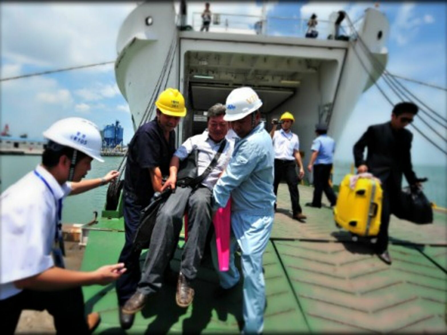 Evacuating Chinese workers hit by violence in Vietnam on May 13.