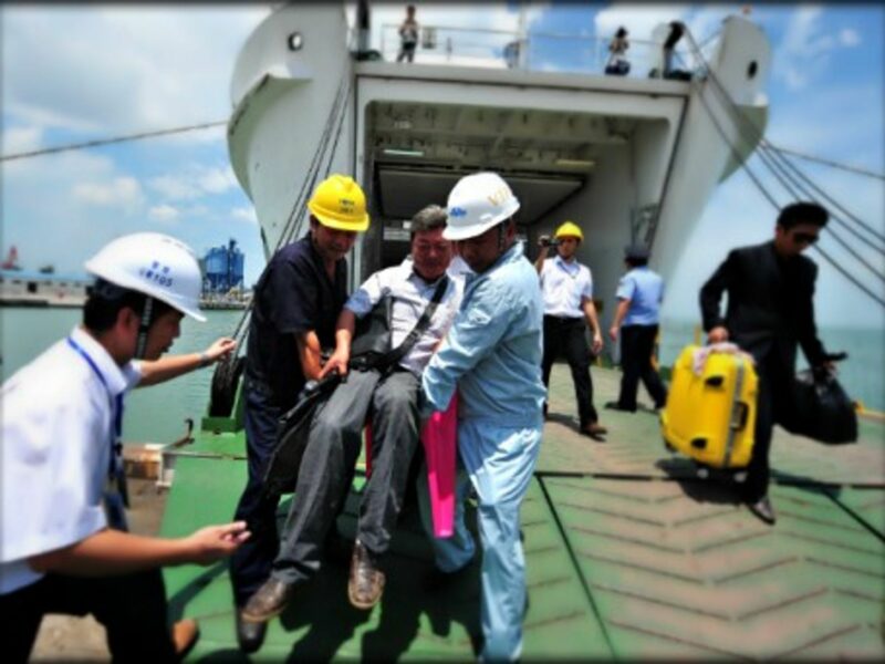 Evacuating Chinese workers hit by violence in Vietnam on May 13.
