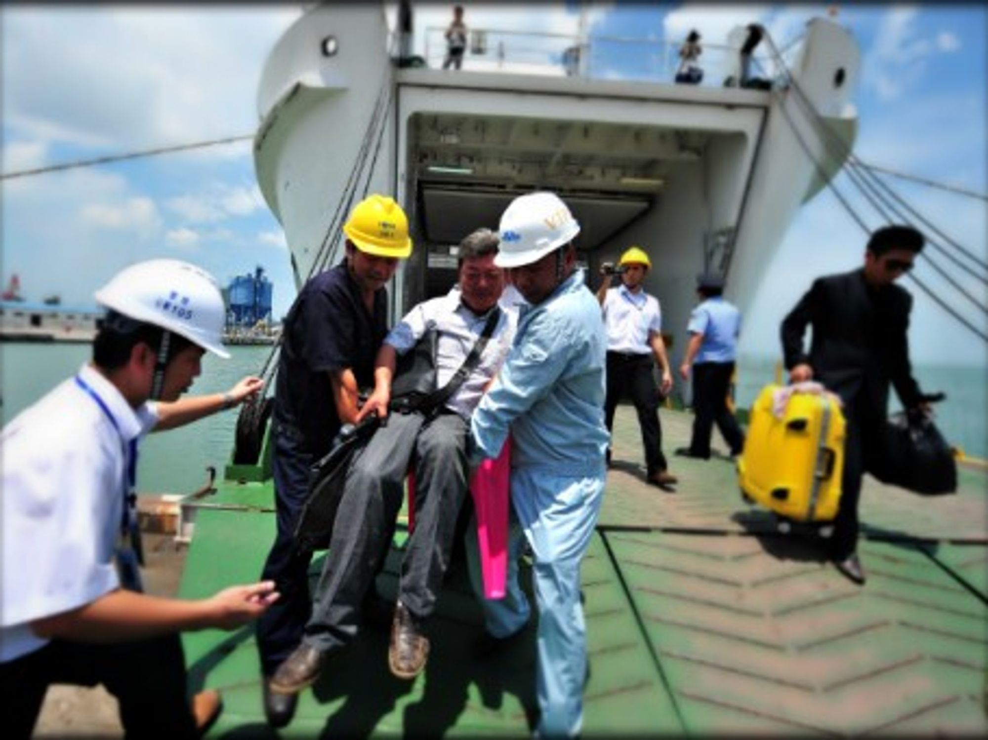 Evacuating Chinese workers hit by violence in Vietnam on May 13.