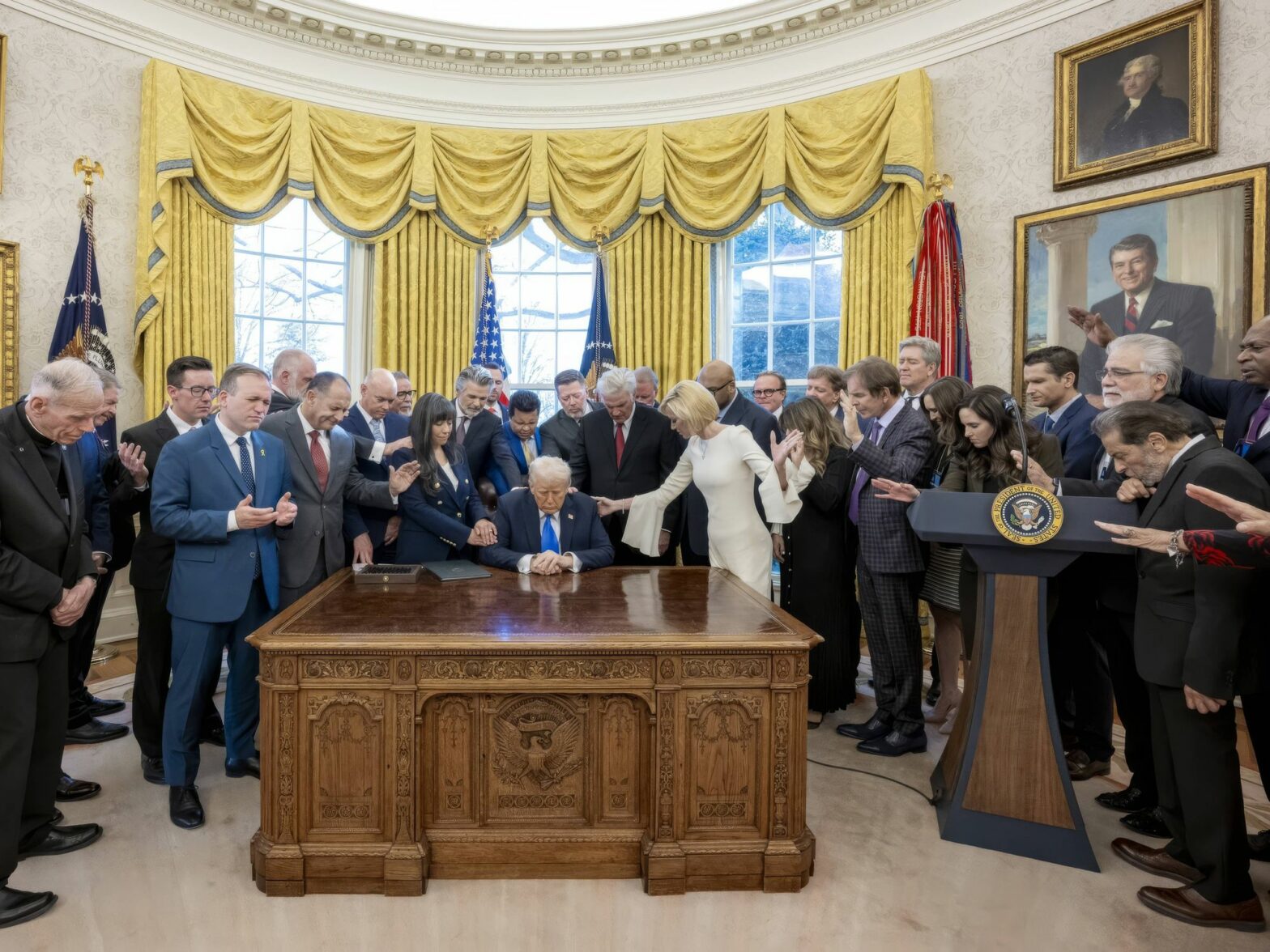 Evangelical Christians surround Donald Trump and pray in the Oval Office of the White House