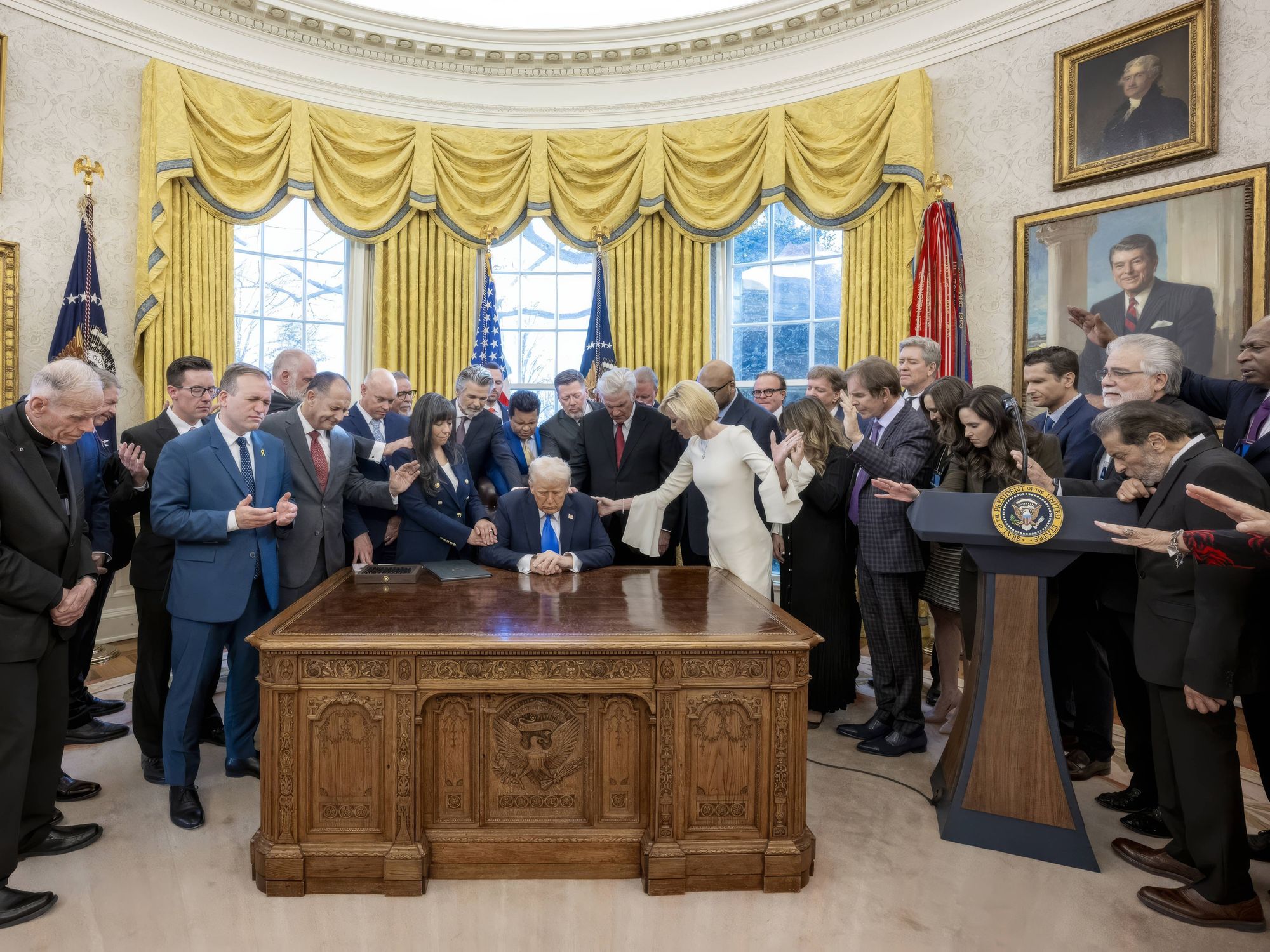 Evangelical Christians surround Donald Trump and pray in the Oval Office of the White House
