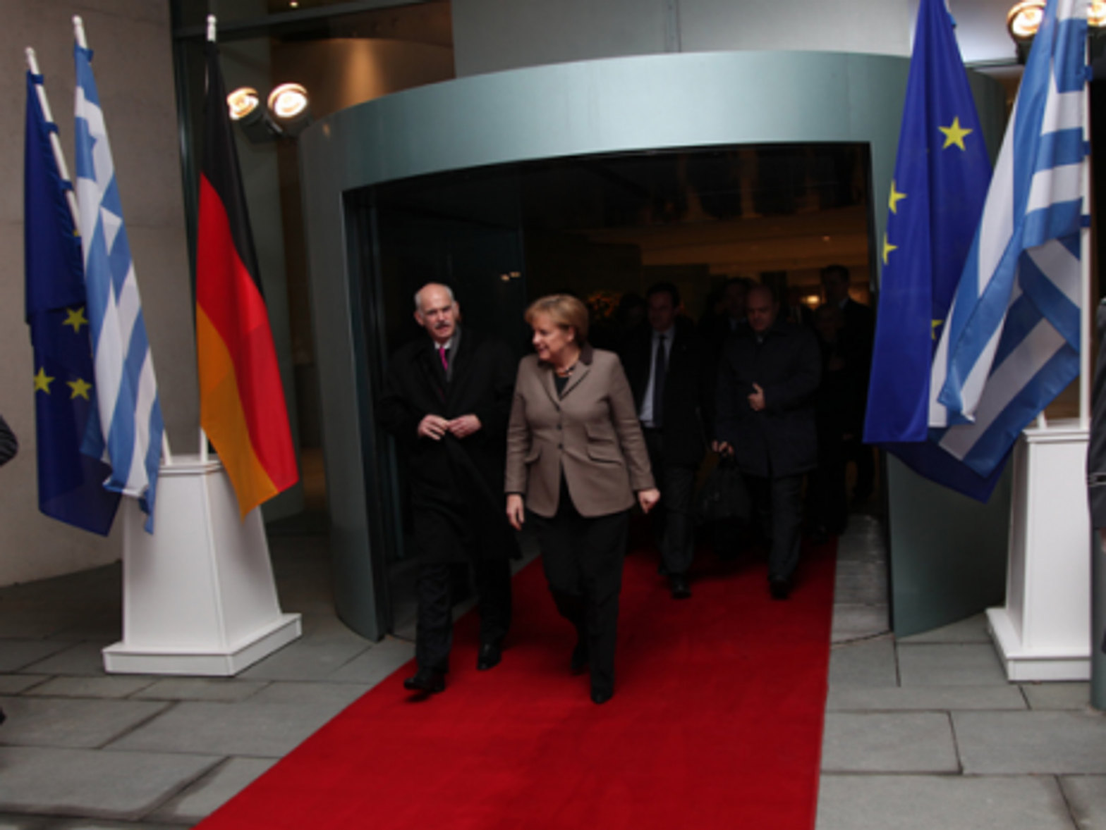 Exit Papandreou, shown last year with German Chancellor Merkel