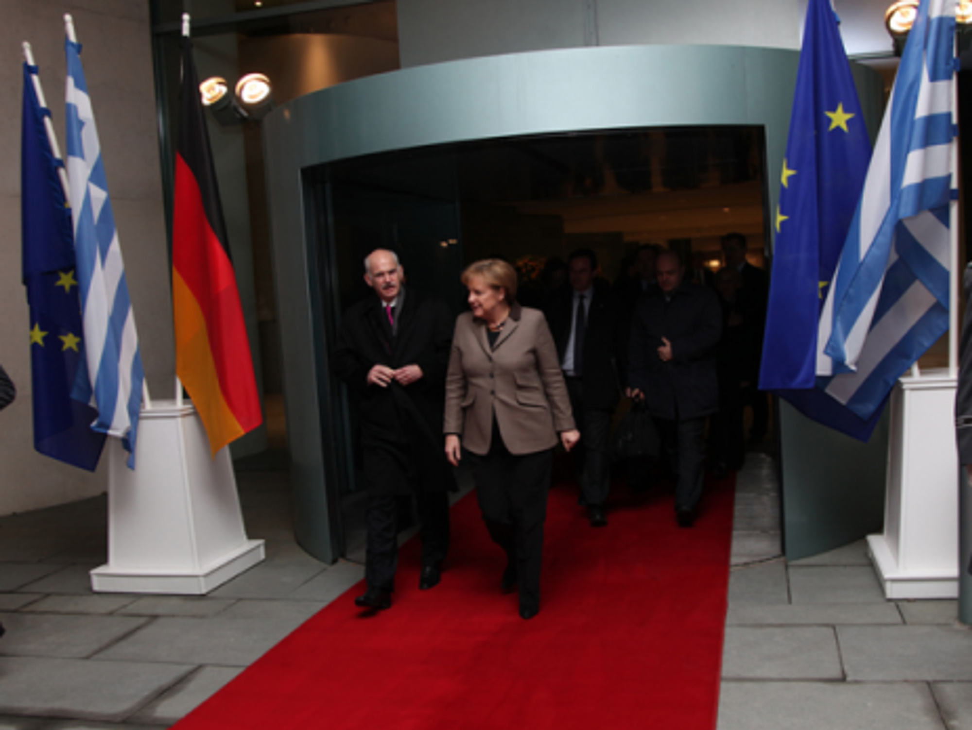 Exit Papandreou, shown last year with German Chancellor Merkel