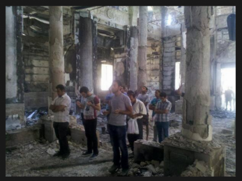 Faithful pray in burned Egyptian Coptic Church