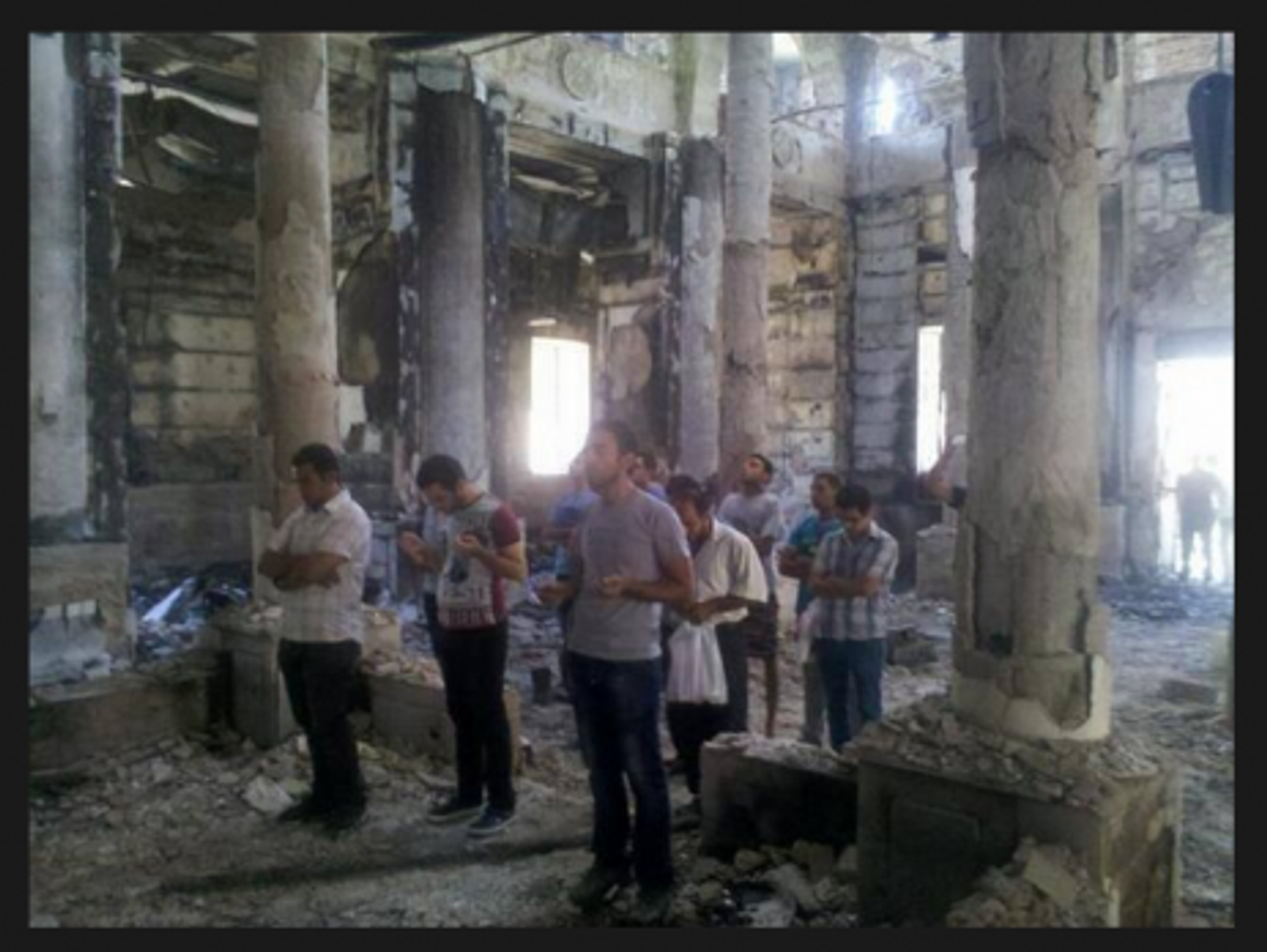 Faithful pray in burned Egyptian Coptic Church