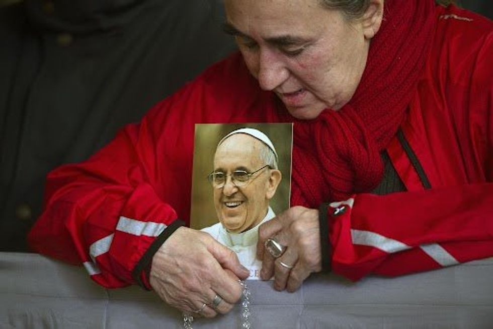 Faithful praying in St. Peter's Square during a vigil rosary for the recovery of Pope Francis on March 19.