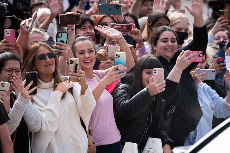 Fans taking pictures of Johnny Depp as he arrives at the courthouse.