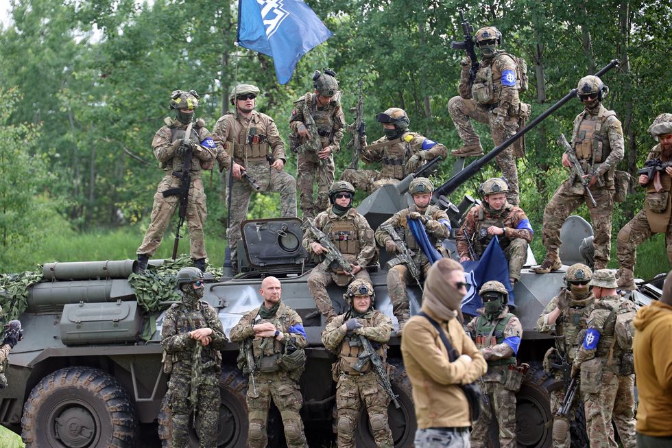 Fighters of the Russian Volunteer Corps (RDK) during a briefing.