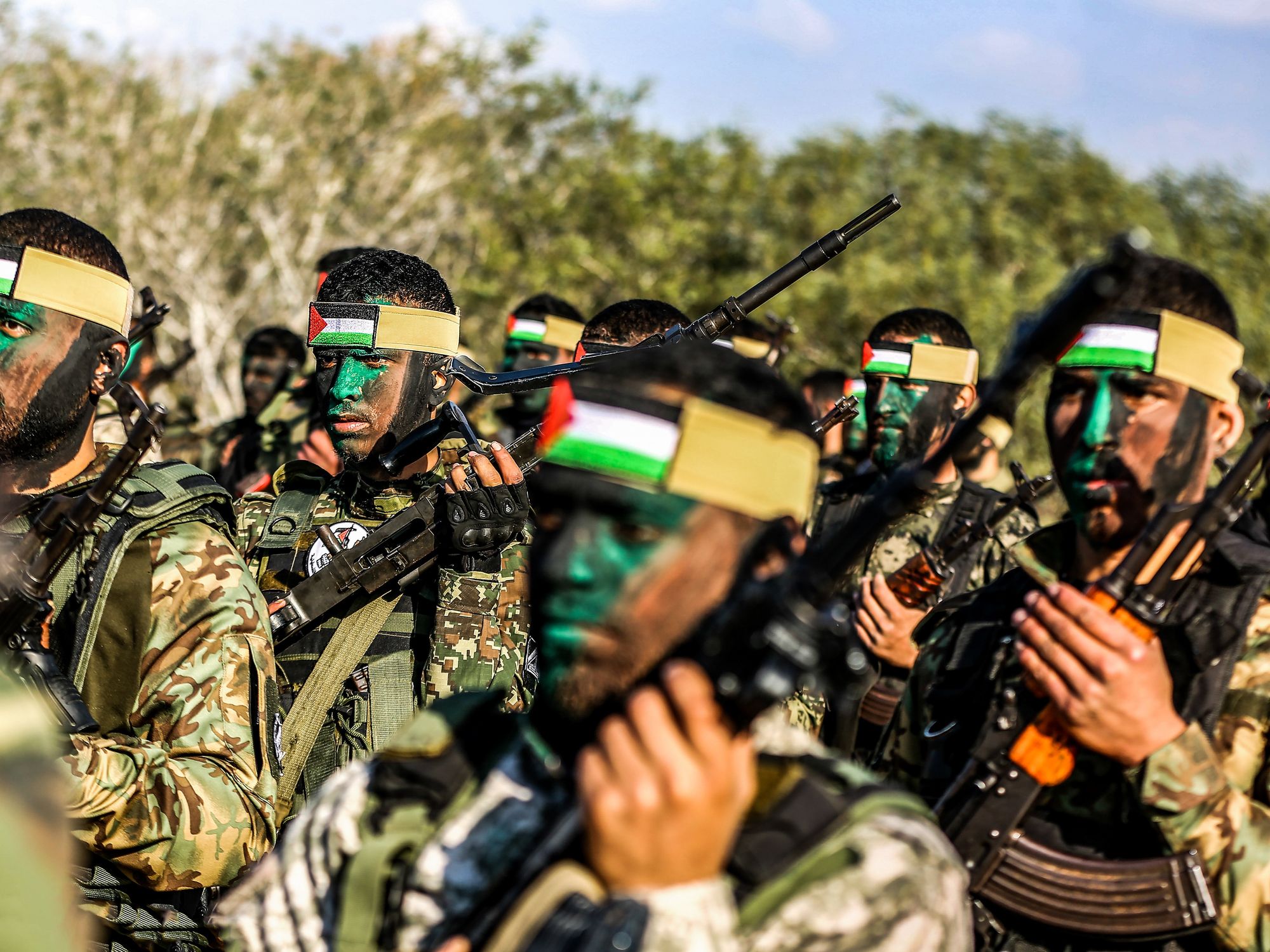 Fighters of various Palestinian resistance groups parade during a joint military exercise taking place in the Gaza Strip.