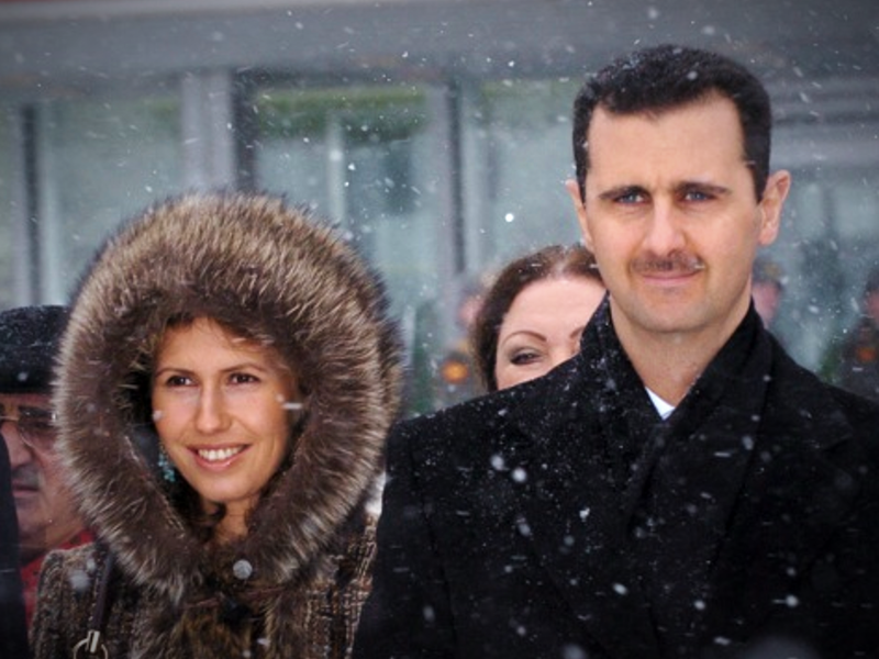 File photo of ​Bashar and Asma al-Assad in Moscow in January 2005