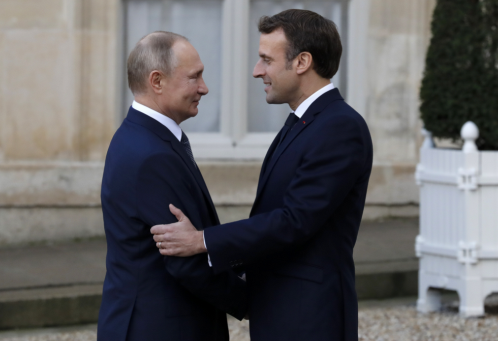 File photo of French President Emmanuel Macron welcoming Russian President Vladimir Putin as he arrives at the Elysee Palace in Paris on Dec. 9, 2019