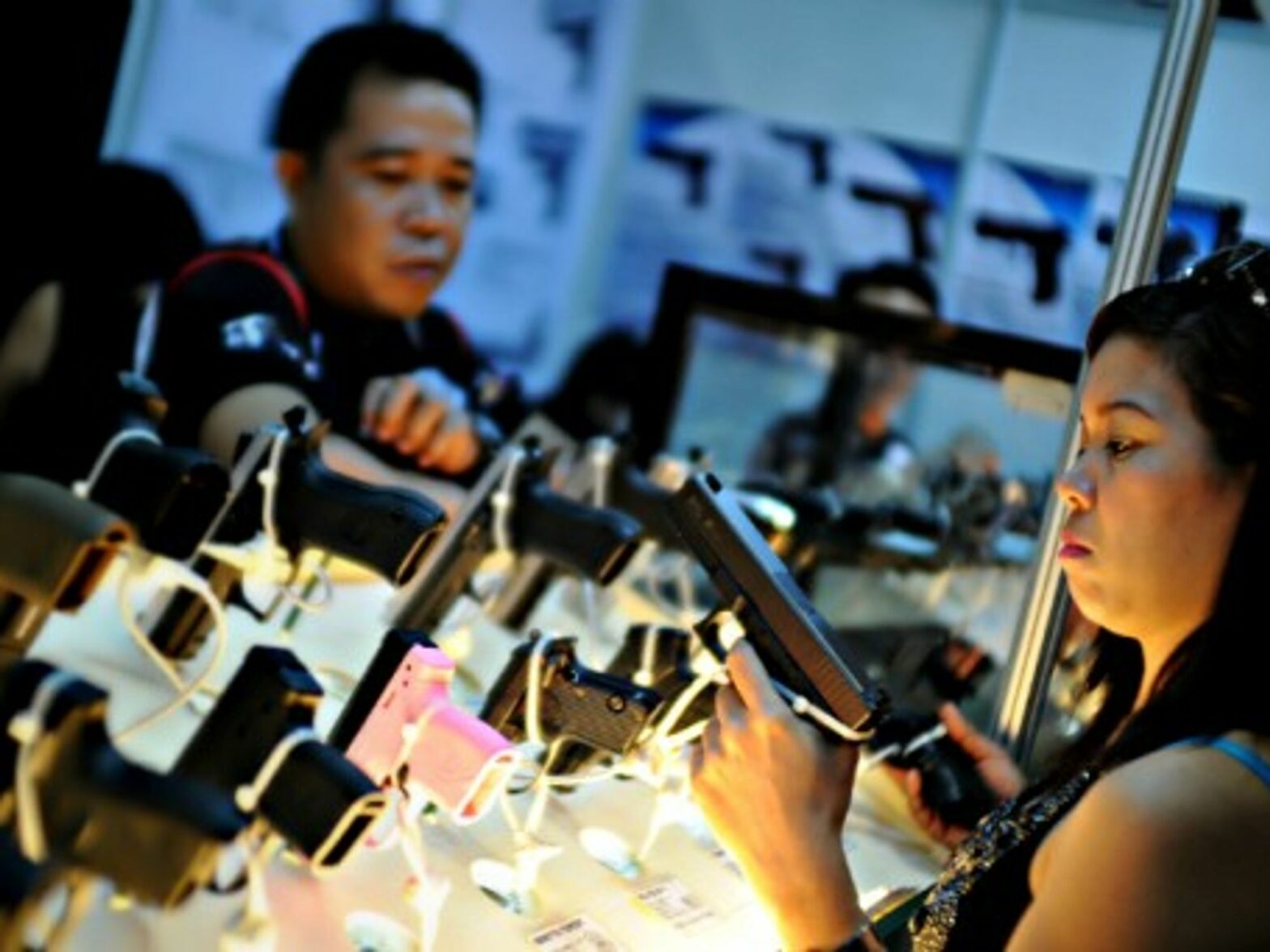 Filipinos at a gun show to promote responsible ownership in Mandaluyong