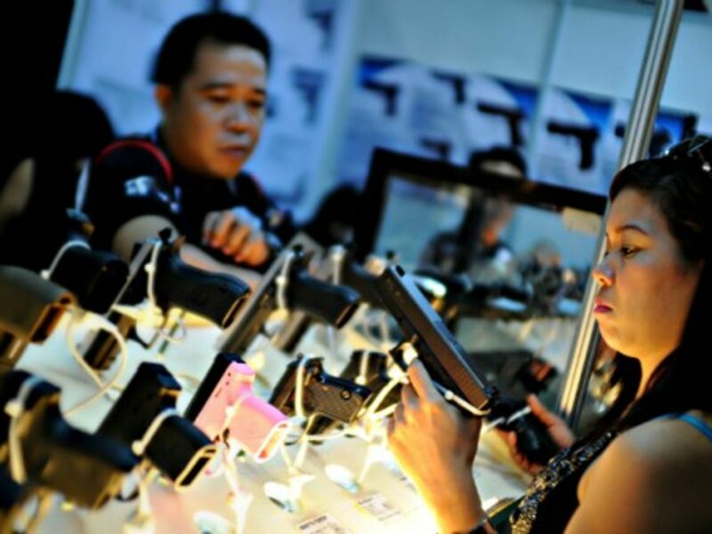 Filipinos at a gun show to promote responsible ownership in Mandaluyong