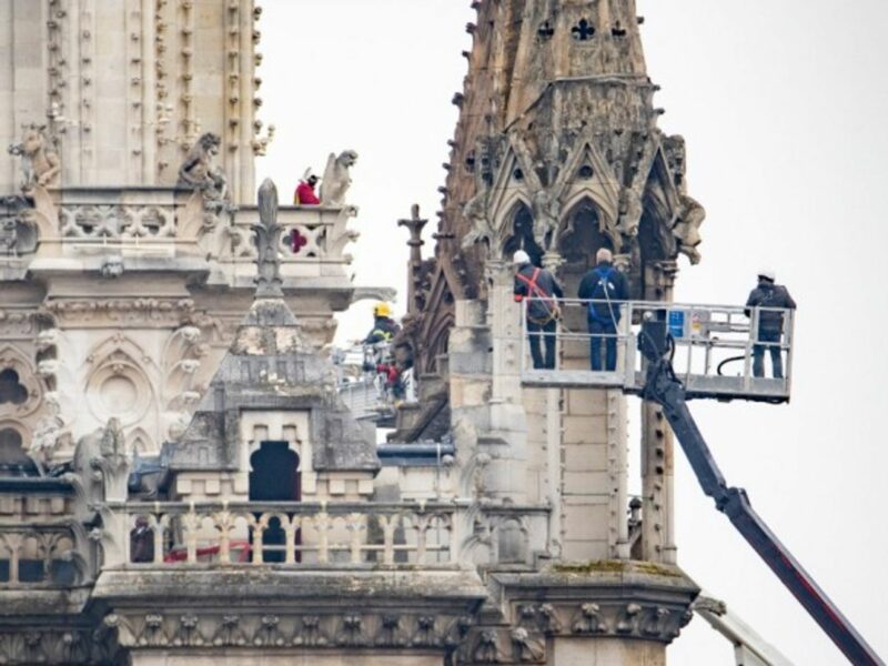 Firefighters assessing the damage at the Notre Dame cathedral
