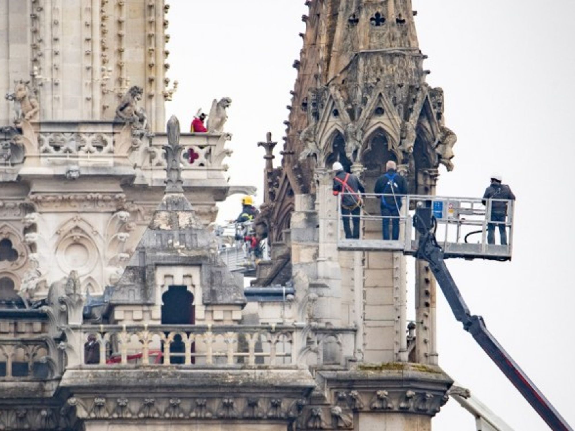 Firefighters assessing the damage at the Notre Dame cathedral