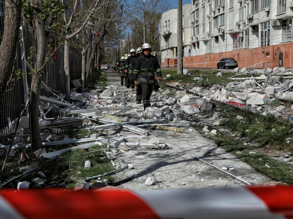 Firefighters walking in devasted streets in Odessa